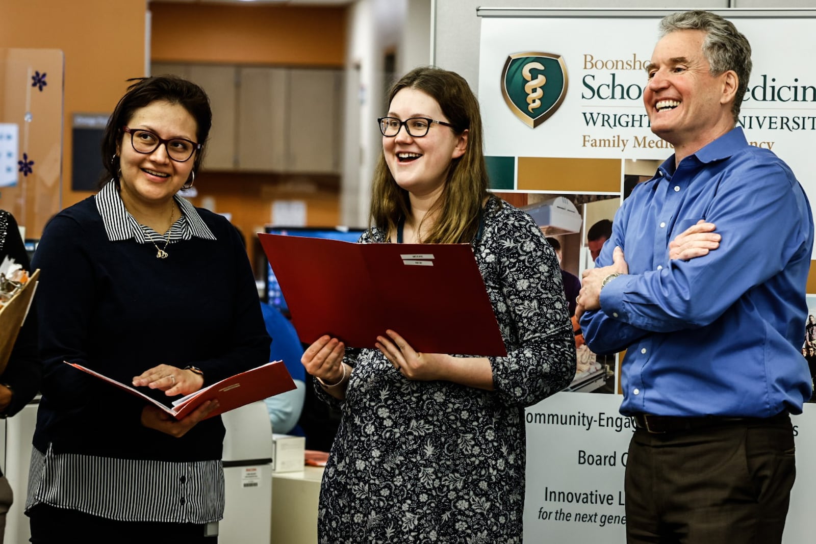 Medical residents, Dr. Alexandra Diaz (left) and  Dr. Anna Moore (center) along with Wright State professor Dr. Peter Reynolds at Five Rivers Family Health Center. Wright State's Boonshoft School of Medicine received a $2.3 million grant for mental health training for residents in their family medicine program in 2023. STAFF / FILE
