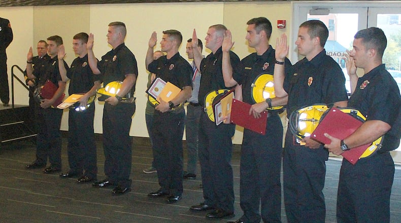 Eight new firefighters were recently sworn in to become members of the Springfield Fire Rescue Division. JEFF GUERINI/STAFF