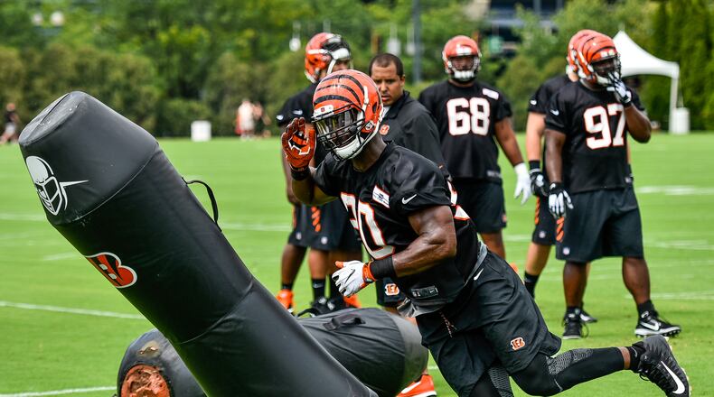 Defensive end Michael Johnson runs through a drill during the first day of Cincinnati Bengals Training Camp Friday, July 28 at the practice fields beside Paul Brown Stadium in Cincinnati. NICK GRAHAM/STAFF