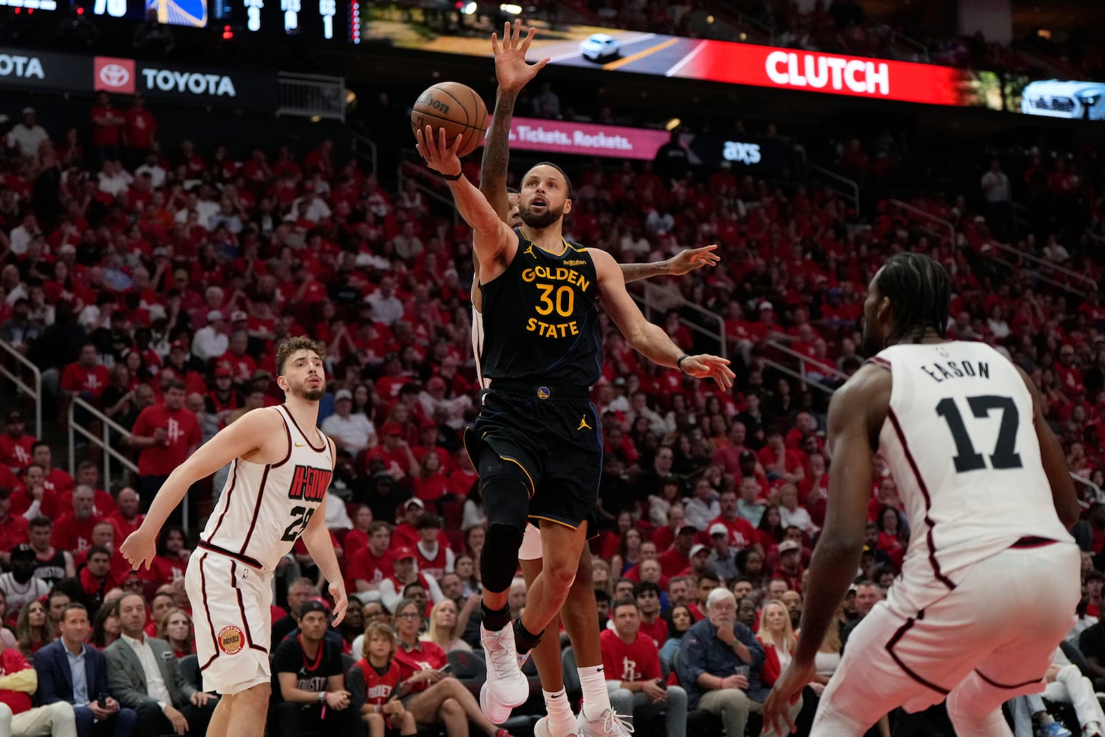 Golden State Warriors' Stephen Curry (30) goes up for a shot as Houston Rockets' Jabari Smith Jr. rear, defends during the second half of Game 7 of an NBA basketball first-round playoff series Sunday, May 4, 2025, in Houston. (AP Photo/Ashley Landis)