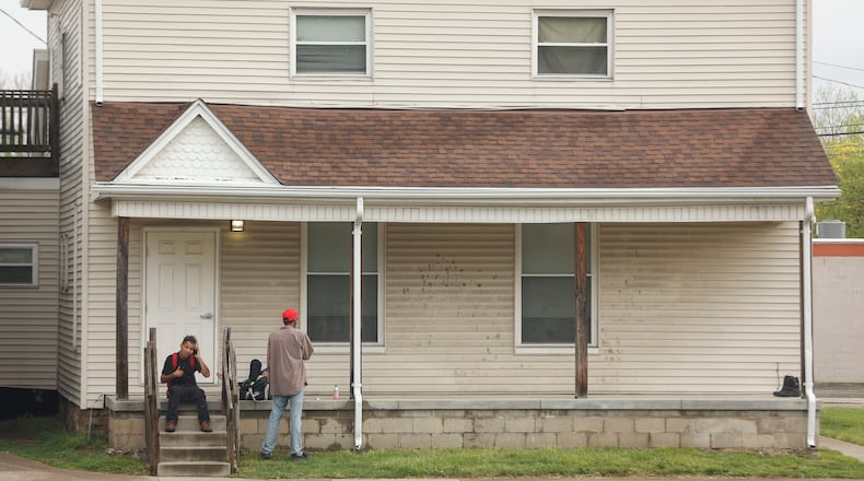 A small group congregates at Sheltered Inc.'s Hartley House on West High Street in Springfield on the morning of Friday, May 2, 2025. JOSEPH COOKE/STAFF