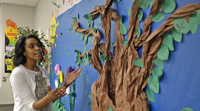 Melinda Clark, a math teacher at Roosevelt Middle School, explains how the learning tree works in her classroom. If a student gets a “C” or above they can put a leaf on the tree with their name on it. Clark is one of this year’s Teachers of the Year. Bill Lackey/Staff