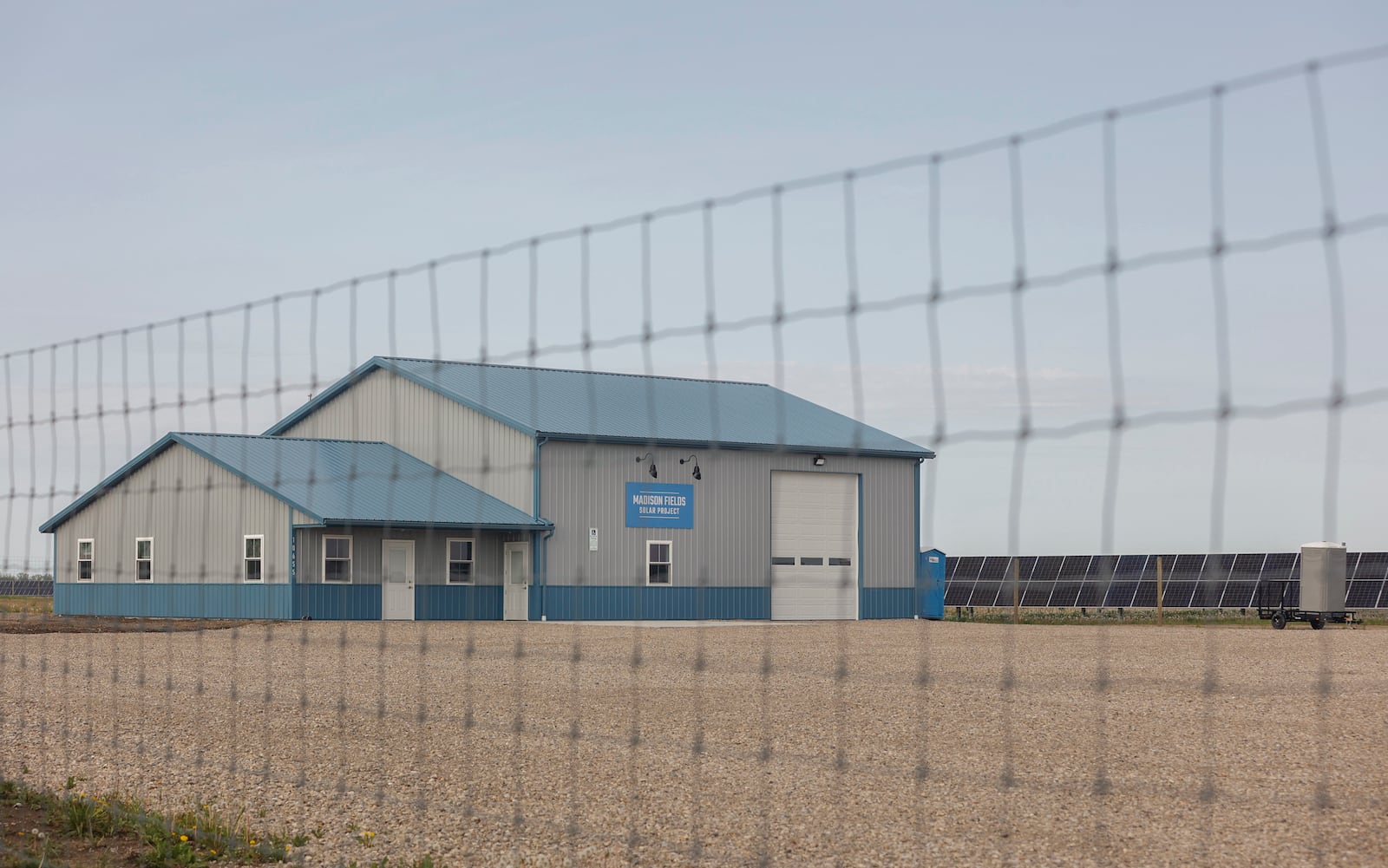 The entrance of the Madison Fields Solar Project sits behind a fence on Wednesday, April 30, 2025. JOSEPH COOKE/STAFF
