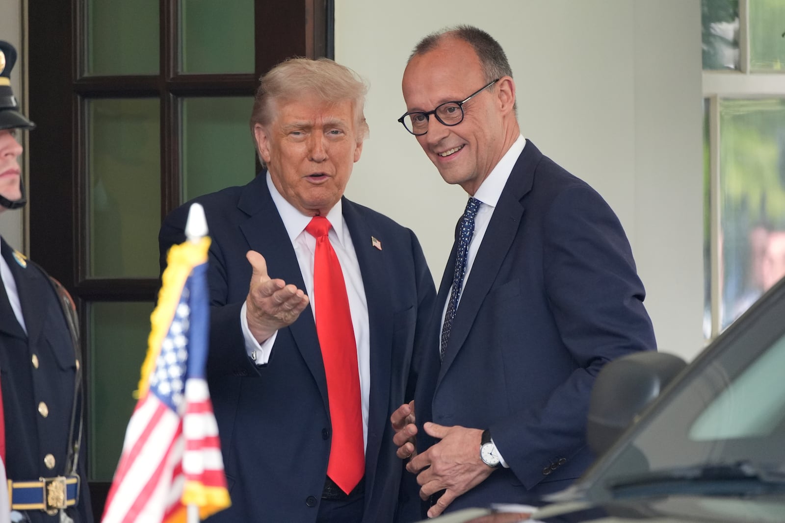 President Donald Trump, left, greets Germany's Chancellor Friedrich Merz upon his arrival at the White House, Thursday, June 5, 2025, in Washington. (AP Photo/Alex Brandon)