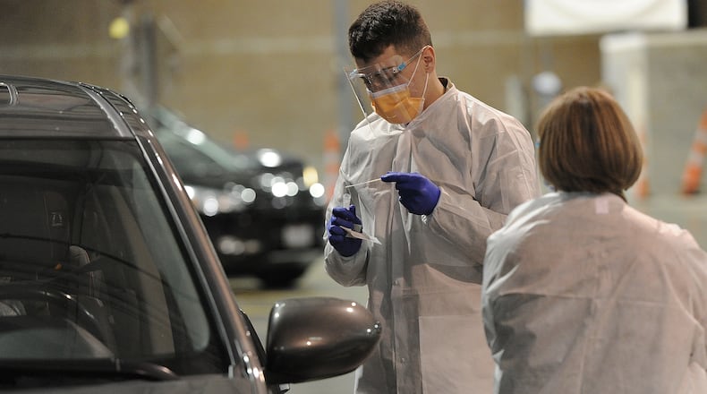 FILE PHOTO: Dayton Children’s is receiving help from the Ohio National Guard at its Springboro COVID-19 testing site, allowing the site to triple its capacity. MARSHALL GORBY\STAFF