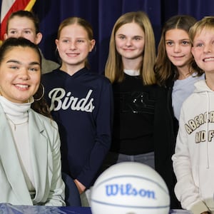 Maddy Westbeld (bottom left), a Fairmont graduate who plays professional basketball for Chicago Sky, poses for a photo with students after talking at an afternoon assembly at J.E. Prass Elementary School in Kettering on Friday, Dec. 12. BRYANT BILLING/STAFF