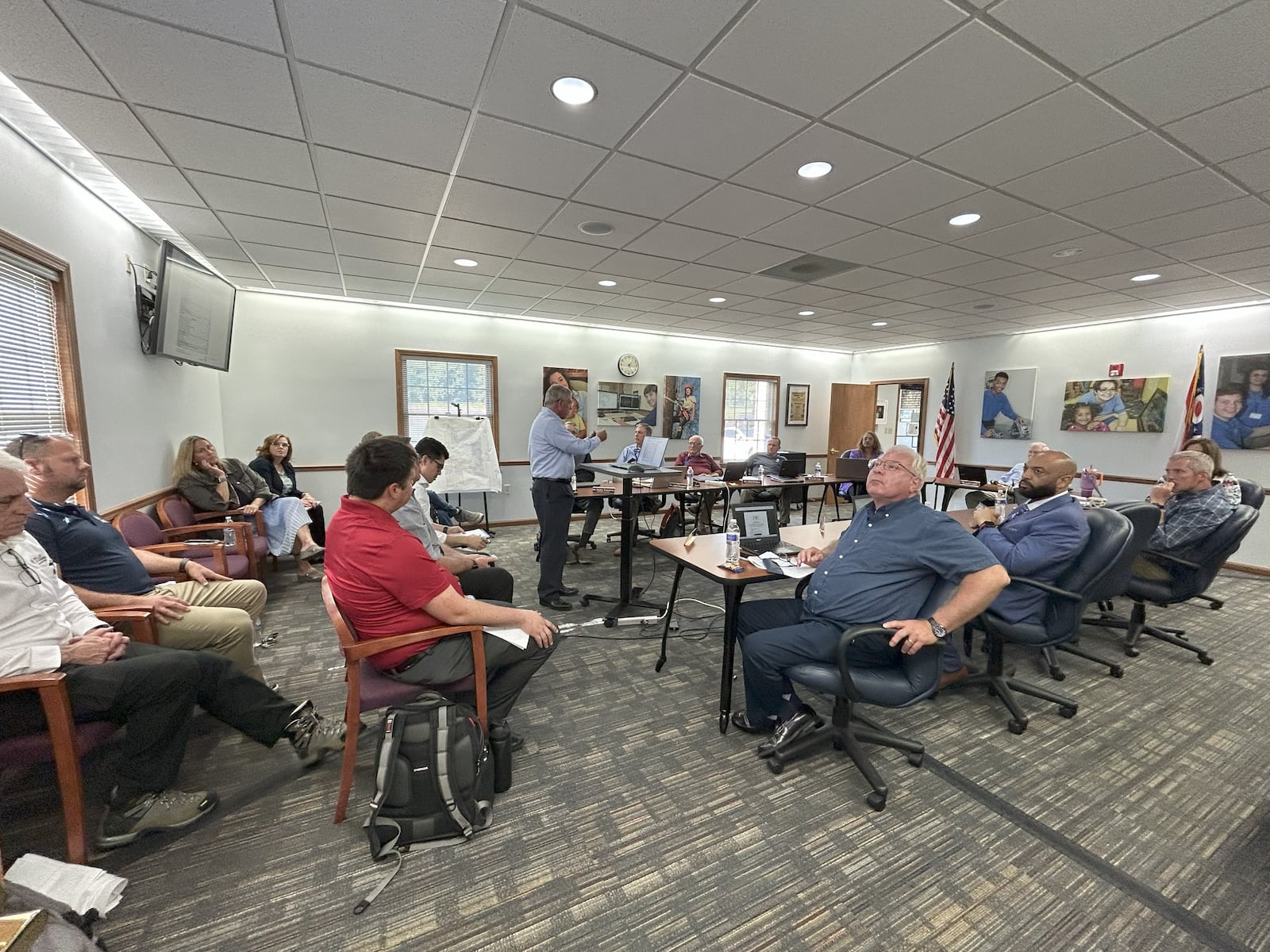 Tony Schorr (middle, standing), principal architect and president of Schorr Architects, which is working on the new Springfield-Clark Career Technology Center (CTC) facility talked to school officials and partners about the project at the Aug. 26 special meeting.