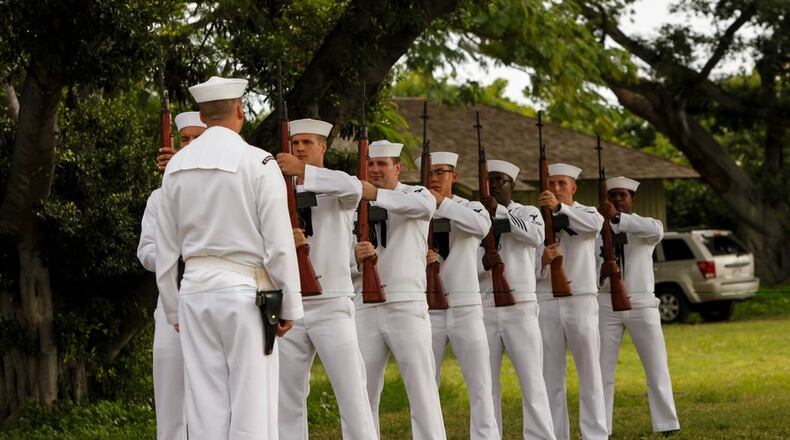 The Navy Region Hawaii Honors and Ceremonies Detachment performs an honors volley during the National Park Service annual USS Oklahoma Memorial Ceremony on Ford Island, Hawaii, Dec. 7, 2015. The USS Oklahoma Memorial honors the 429 men killed aboard Oklahoma Dec. 7, 1941. (U.S. Marine Corps Photo by Lance Cpl. Maximiliano Rosas/Released)