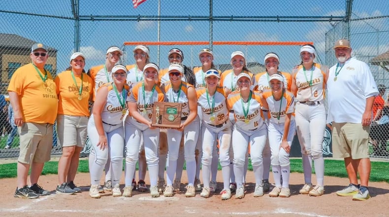 The Kenton Ridge High School softball team poses with a Division II district championship trophy after beating Franklin 13-4 on Saturday afternoon at Arcanum High School. CONTRIBUTED