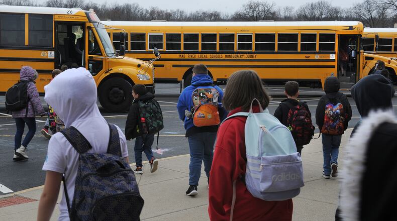 Students at Stevenson Elementary school head to the buses Friday March 11, 2022. MARSHALL GORBY\STAFF