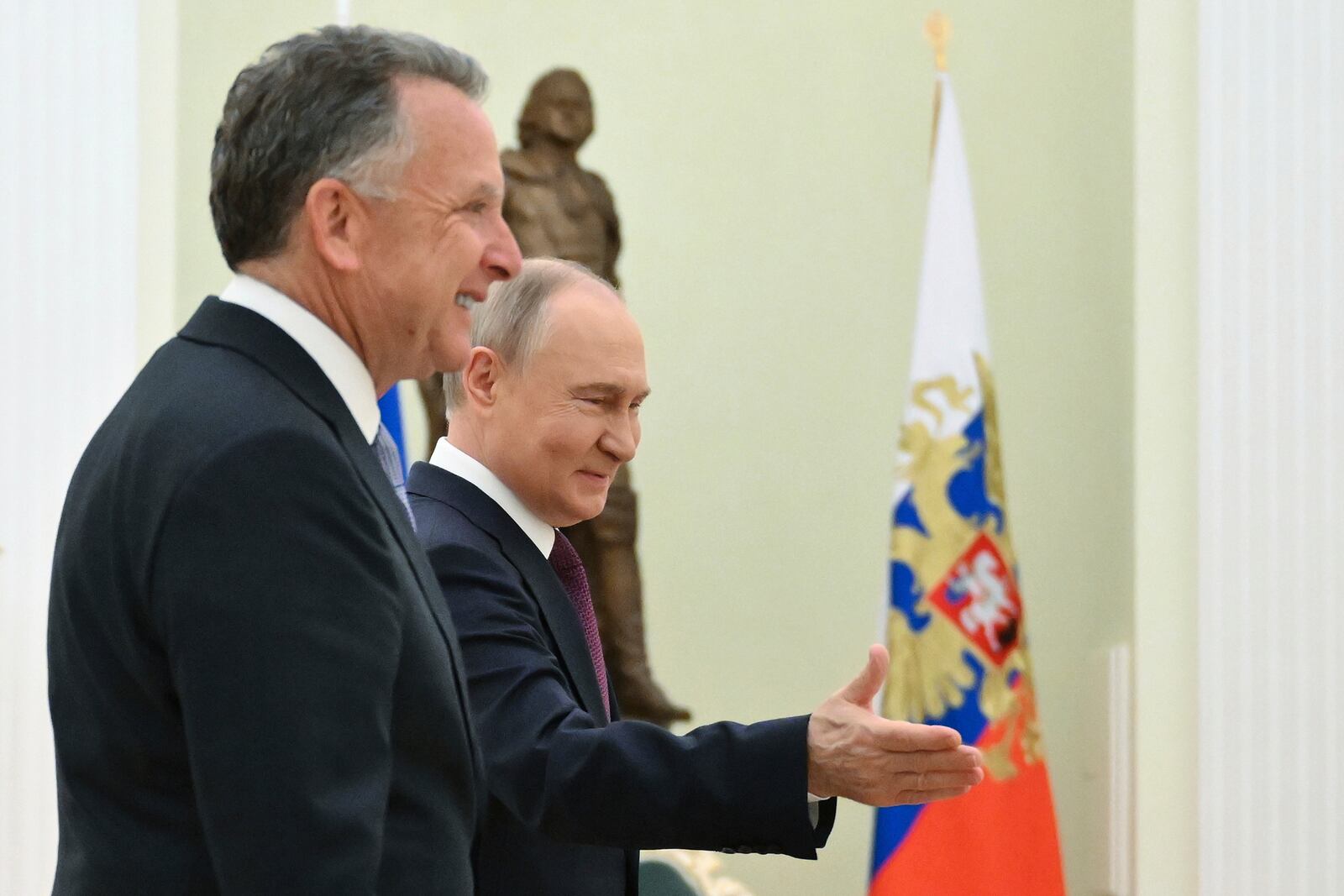 Russian President Vladimir Putin, center, welcomes U.S. President Donald Trump's special envoy Steve Witkoff to their talks at the Kremlin in Moscow, Russia, Friday, April 25, 2025. (Kristina Kormilitsyna, Sputnik, Kremlin Pool Photo via AP)