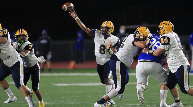 Springfield's Te'Sean Smoot throws a touchdown pass to Anthony Brown in the first half against St. Xavier in a Division I state semifinal on Friday, Nov. 6, 2020, at Alexander Stadium in Piqua. David Jablonski/Staff