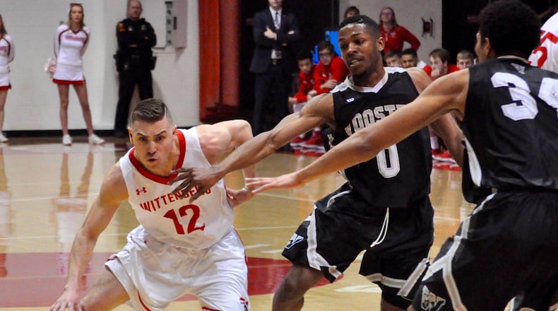 Wittenberg’s Mitchell Balser drives the ball against the Wooster defense during the Tigers regular-season finale in Springfield Feb. 17, 2018. Nick Dudukovich/CONTRIBUTED