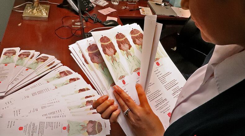 Capt. Anita Albert-Watson looks over some of the tags for the Springfield Salvation Army's Angel Trees Friday. BILL LACKEY/STAFF