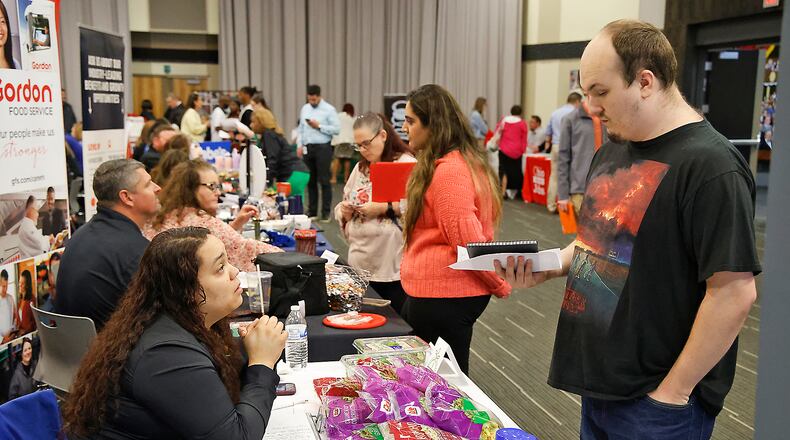 Damion Miller talks with Brionna Cannon, a recruiter from Dole, Wednesday, April 17, 2024 during the 14th Annual Clark County Job Fair at the Hollenbeck Bayley Conference Center. BILL LACKEY/STAFF