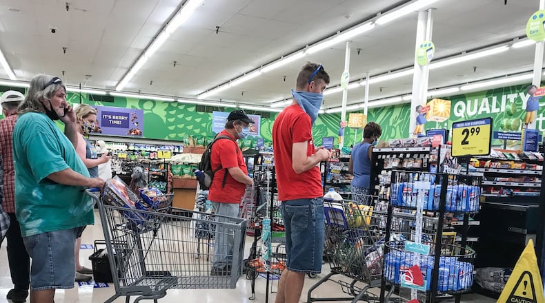 People wait in line at the Krogers on Wayne Ave. Thursday July 9, 2020. The U.S. Census Bureau looked at how Americans spent their stimulus checks. JIM NOELKER/STAFF