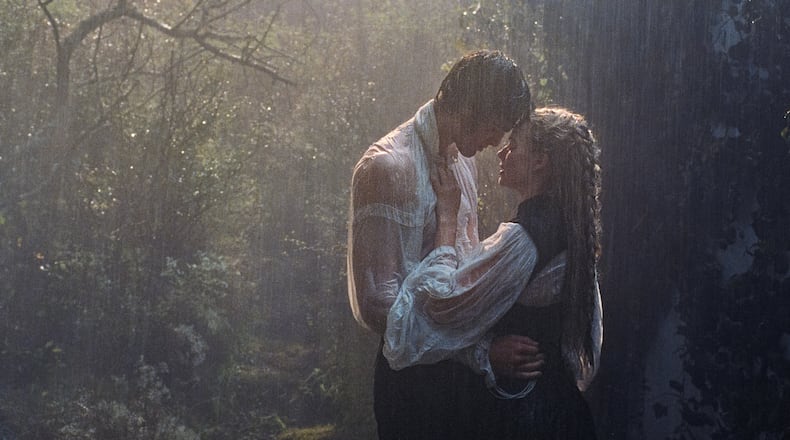 This image released by Warner Bros. Pictures shows Margot Robbie, right, and Jacob Elordi in a scene from "Wuthering Heights." (Warner Bros. Pictures via AP)
