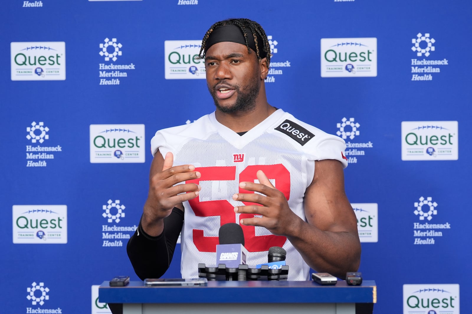 New York Giants' Bobby Okereke talks to reporters after an NFL football practice in East Rutherford, N.J., Wednesday, May 28, 2025. (AP Photo/Seth Wenig)