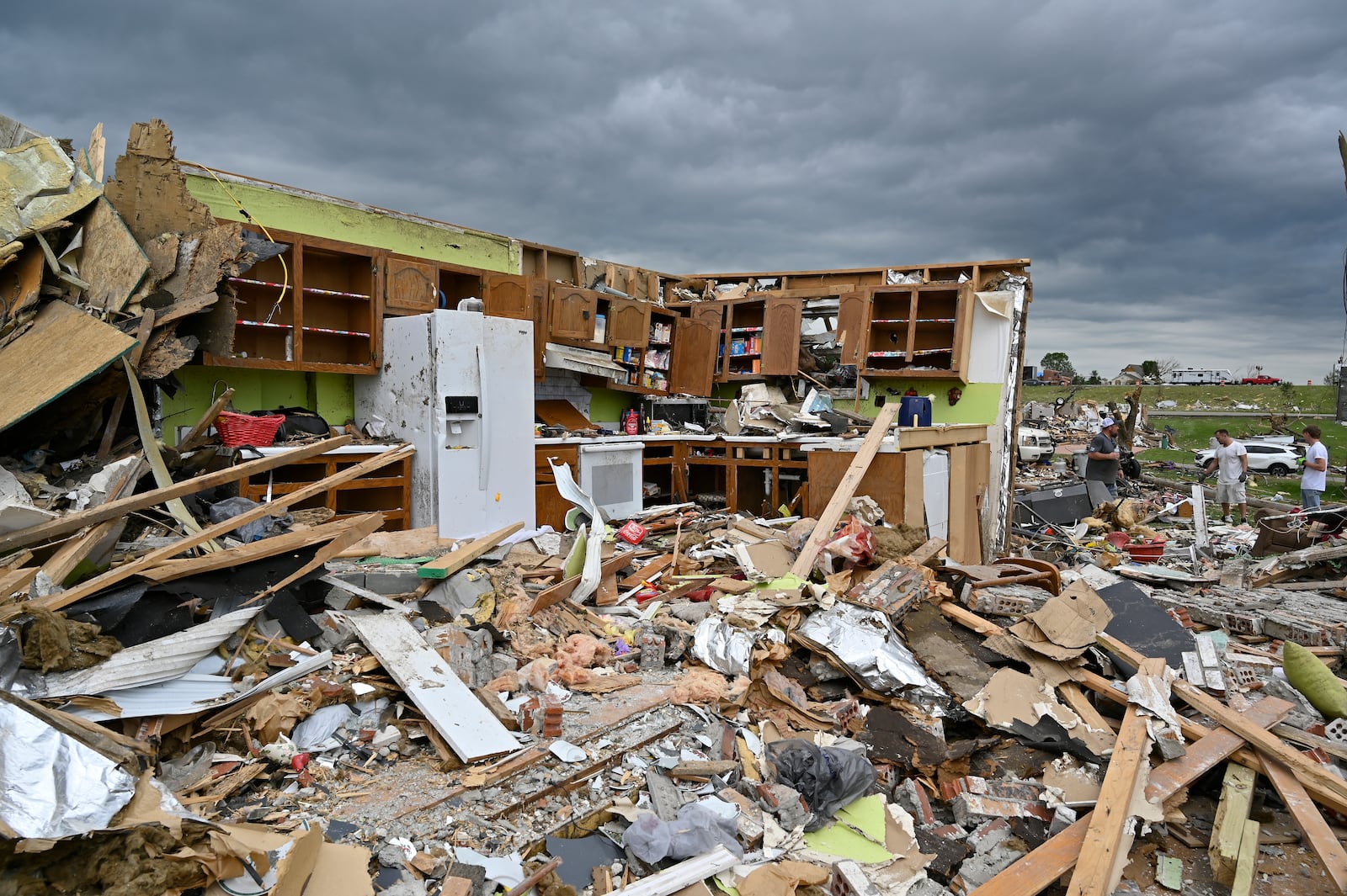 FILE - The remains of a kitchen surrounded by debris after severe storms in the Sunshine Hills neighborhood in London, Ky., May 19, 2025. (AP Photo/Timothy D. Easley, File)