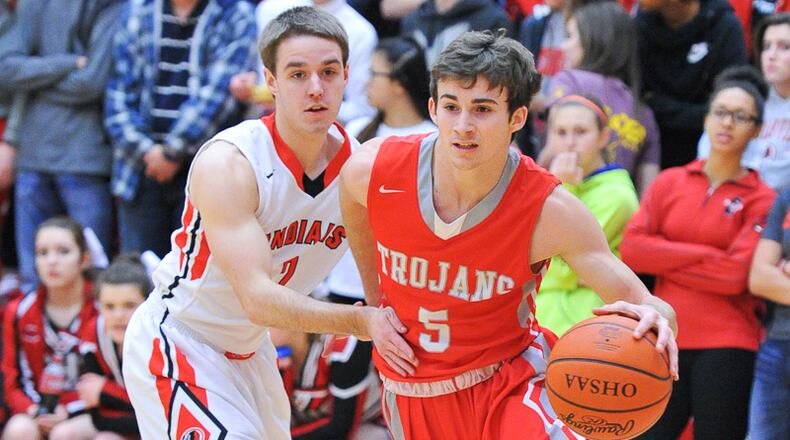 Southeastern senior Trevor King (right) dribbles by Cedarville’s Alex Zaage (left) during an Ohio Heritage Conference game on Friday night. Contributed Photo by Bryant Billing