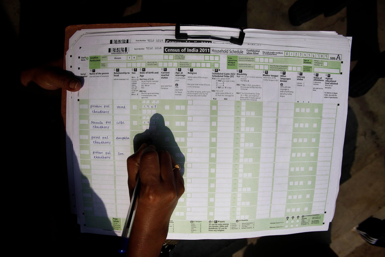FILE -A census official collects information from a household in Bonda, on the outskirts of Gauhati, India, Feb. 11, 2011. (AP Photo/Anupam Nath, File)