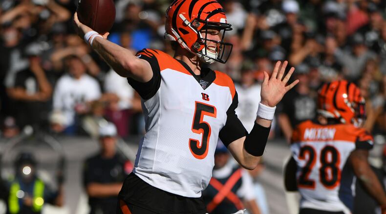 OAKLAND, CALIFORNIA - NOVEMBER 17: Ryan Finley #5 of the Cincinnati Bengals attempts a pass against the Oakland Raiders during their NFL game at RingCentral Coliseum on November 17, 2019 in Oakland, California. (Photo by Robert Reiners/Getty Images)