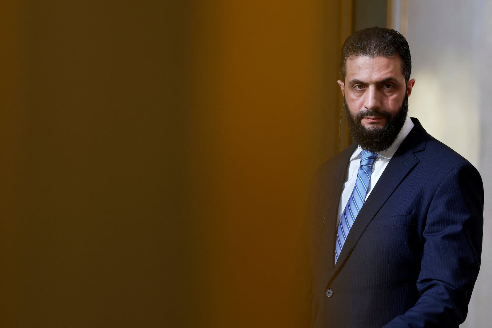FILE - Syria's interim president, Ahmad al-Sharaa, listens during a press conference in Paris, May 7, 2025. (Stephanie Lecocq/Pool via AP, File)
