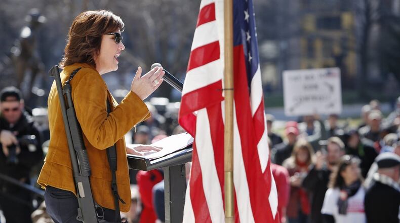 Lt. Gov. Mary Taylor carried a shotgun at a rally of gun groups such as Ohio Carry Saturday, March 10 at the Statehouse. Photo by Eric Albrecht/Columbus Dispatch