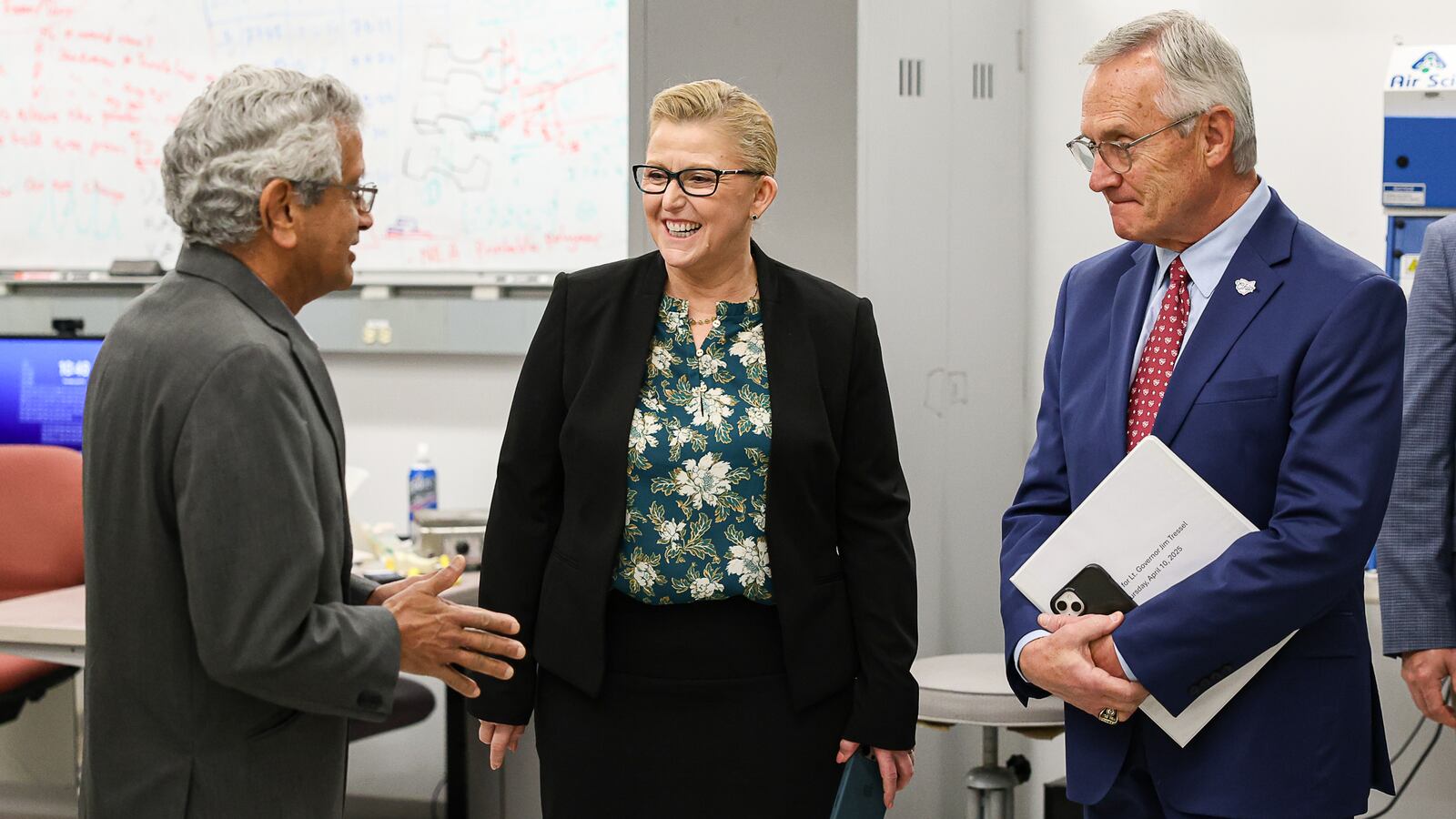 Wright State President Sue Edwards, center, and Lt. Gov. Jim Tressel laugh during a presentation by engineering professor Raghu Srinivasan during a tour of the campus on Thursday. BRYANT BILLING / STAFF