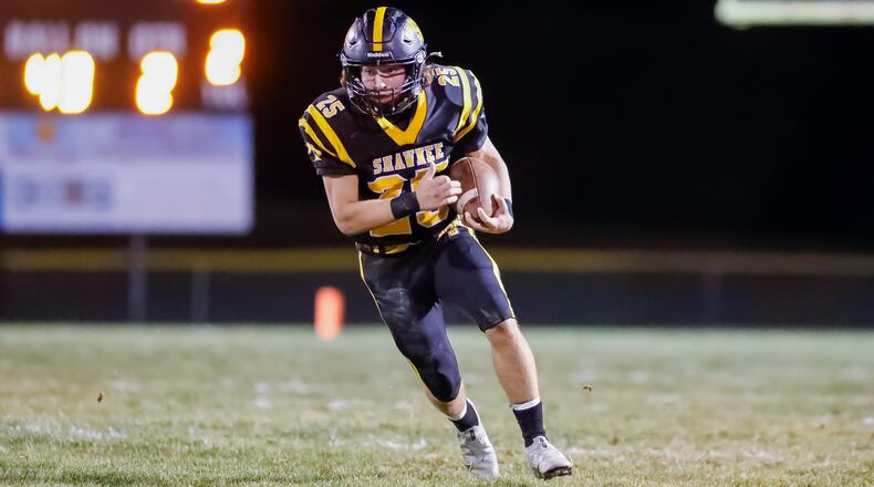 Shawnee High School junior T.J. Meeks runs the ball during their playoff game last week against Roger Bacon in Springfield. Meeks has scored eight touchdowns in the Braves last two games. CONTRIBUTED PHOTO BY MICHAEL COOPER
