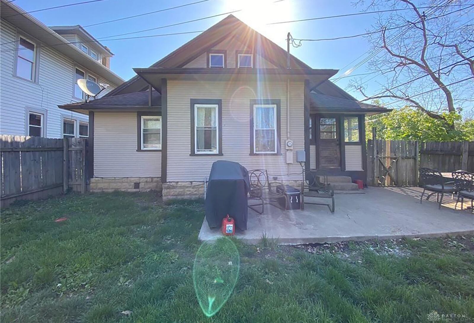 A concrete patio in back of the home, and there is stone trim on the house. The back yard is surrounded by a wood privacy fence. The property includes a detached, 2-car garage. CONTRIBUTED PHOTO