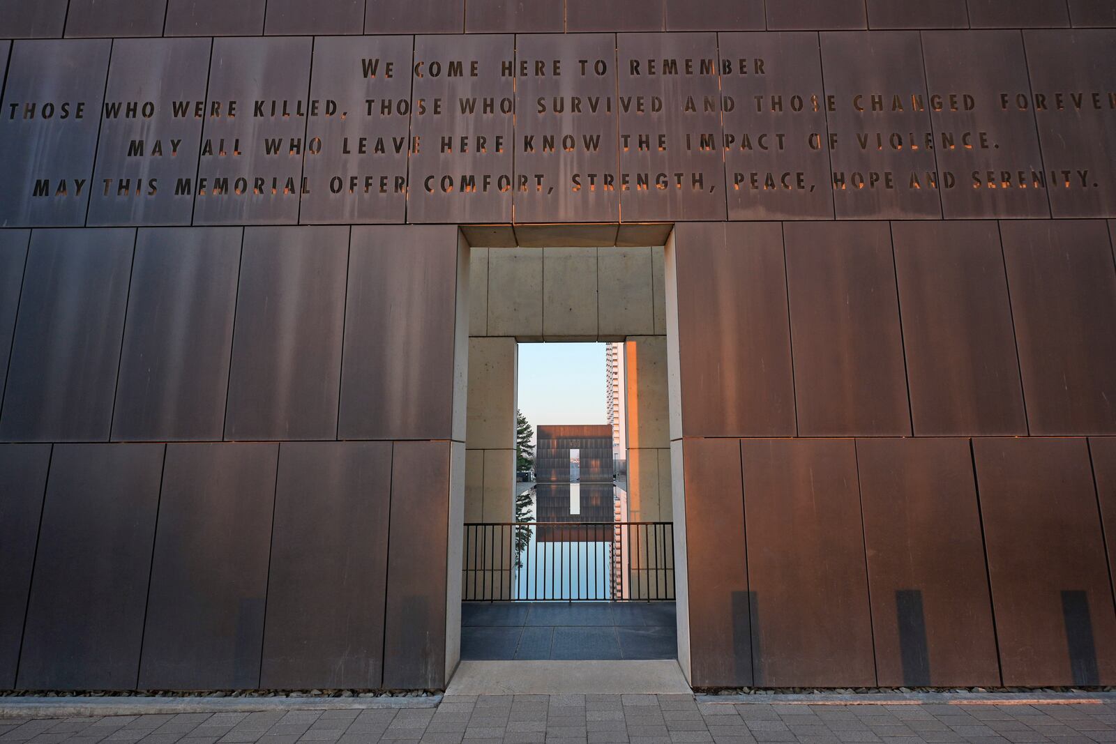 The inscription above the entrance to the Oklahoma City National Memorial & Museum reads, "We come here to remember those who were killed, those who survived and those changed forever. May all who leave here know the impact of violence. May this memorial offer comfort, strength, peace, hope and serenity," in Oklahoma City on March 13, 2025. (AP Photo/LM Otero)