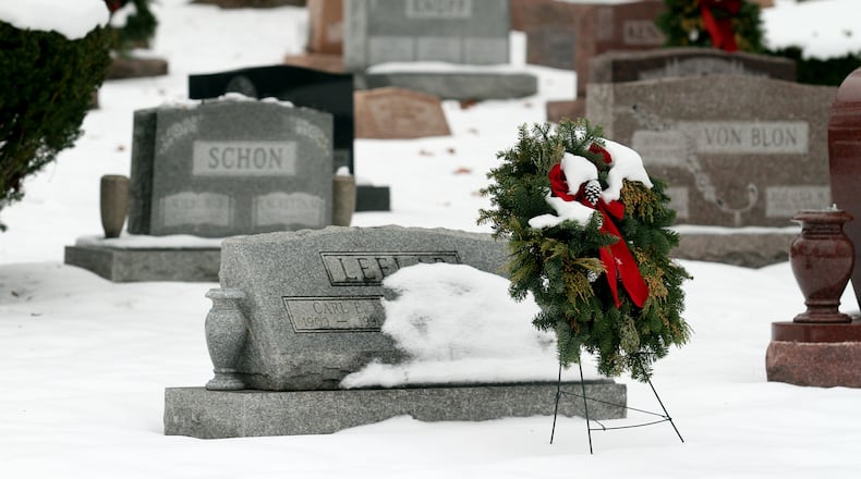 Winter can make decorating a gravesite difficult. Staff photo