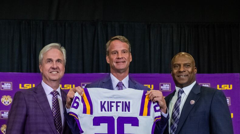 LSU president Wade Rousse and athletic director Verge Ausberry pose with new head football coach Lane Kiffin after an introductory news conference, Monday, Dec. 1, 2025, in Baton Rouge, La. (Michael Johnson/The Advocate via AP)