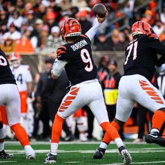 Cincinnati Bengals quarterback Joe Burrow passes the ball with protection from offensive linemen Dalton Risner (left) and Amarius Mims during their game against the Cleveland Browns on Sunday, Jan. 4, 2026 at Paycor Stadium. JEREMY MILLER / CONTRIBUTED PHOTO