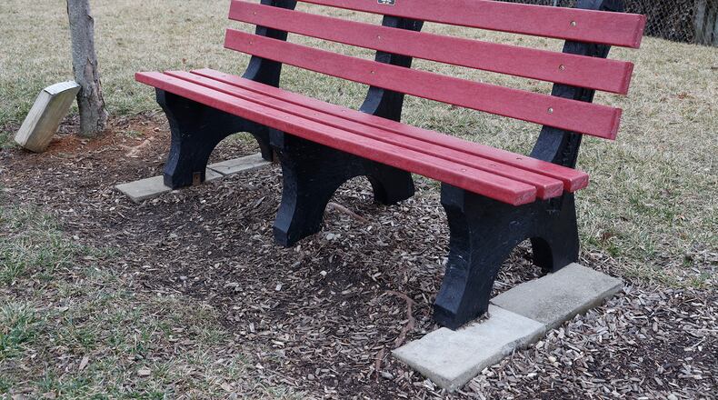 A plastic memorial bench remembering Justin White at St. Teresa Catholic Church Feb. 10, 2023. BILL LACKEY/STAFF