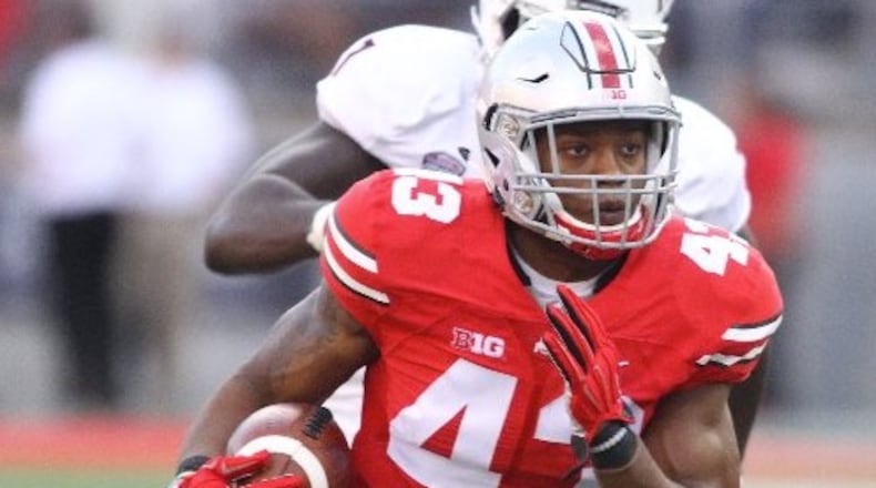 Ohio State linebacker Darron Lee returns an interception for a touchdown in the third quarter against Northern Illinois on Saturday, Sept. 19, 2015, at Ohio Stadium in Columbus. David Jablonski/Staff