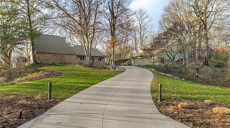 This West Kettering estate style home sits on 1.3 wooded acres and has a separate four car garage with an apartment above. CONTRIBUTED