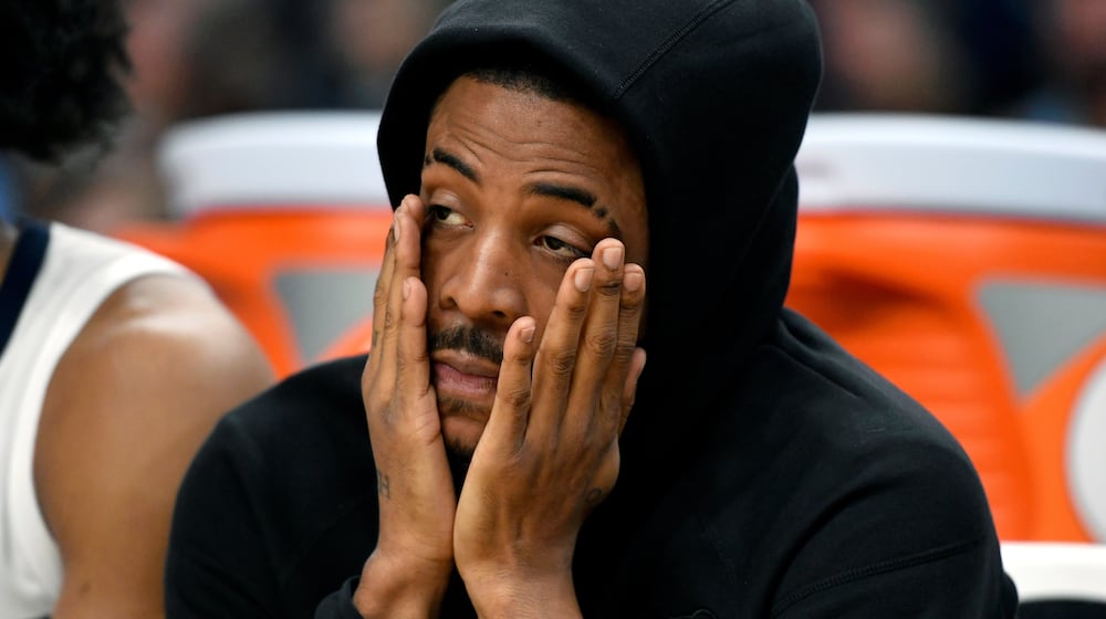 Memphis Grizzlies guard Ja Morant looks on from the bench in the second half of an NBA basketball game against the Phoenix Suns Wednesday, Jan. 7, 2026, in Memphis, Tenn. (AP Photo/Brandon Dill)