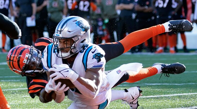 Carolina Panthers tight end Tommy Tremble (82) makes a touchdown catch as Cincinnati Bengals safety Dax Hill (23) defends during the second half of an NFL football game, Sunday, Nov. 6, 2022, in Cincinnati. (AP Photo/Joshua A. Bickel)