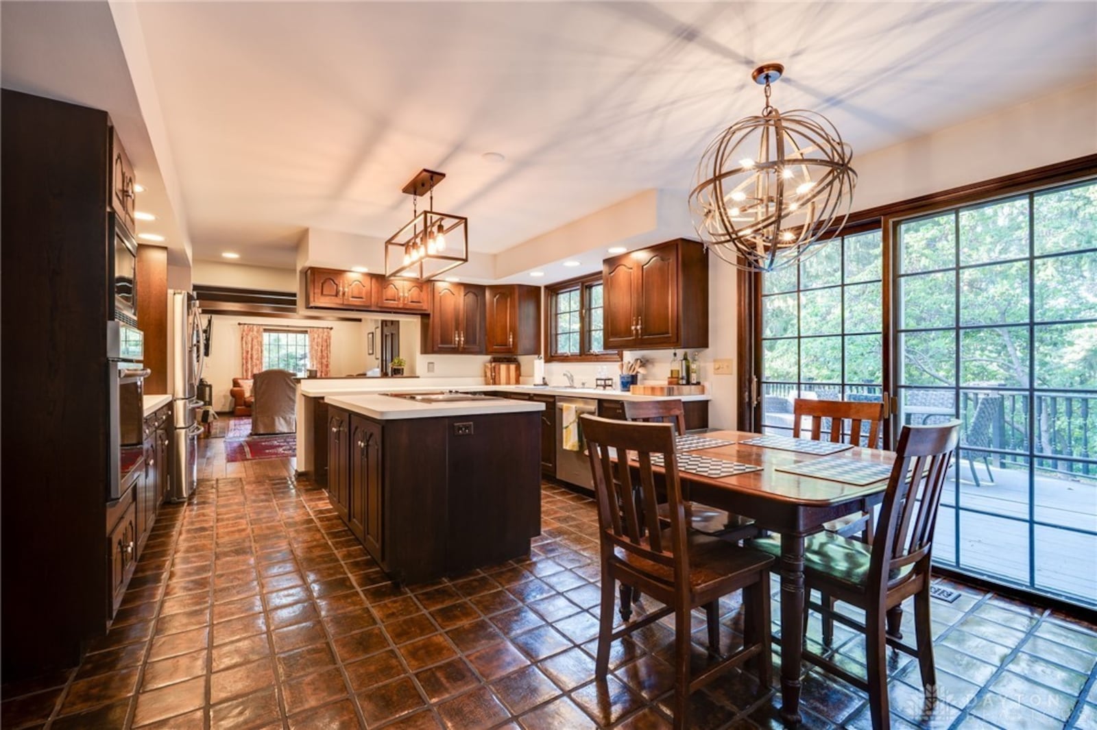 The kitchen has tile flooring and updated appliances and an exterior door off the breakfast room opening to the rear deck. CONTRIBUTED