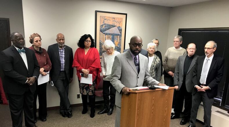 Rev. Rockney Carter of Zion Baptist Church shares details of the expanded civil rights complaint that he and other west Dayton clergy filed against Premier Health over the closing of Good Samaritan Hospital. KAITLIN SCHROEDER