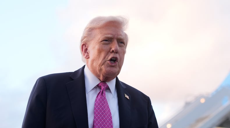 President Donald Trump speaks to reporters after arriving on Air Force One, Friday, Oct. 17, 2025, at Palm Beach International Airport in West Palm Beach, Fla. (AP Photo/Mark Schiefelbein)