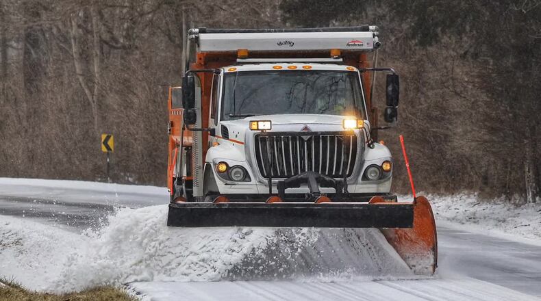Butler County Engineer's Office snow plow clears ice from Elk Creek Road