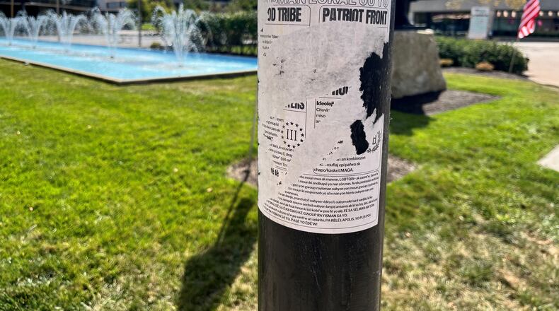 Flyers on the City Hall Plaza in Springfield warn about hate groups. JESSICA OROZCO/STAFF