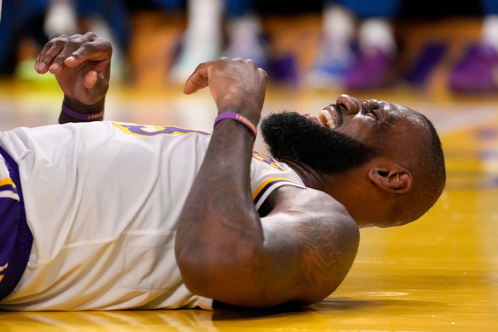 Los Angeles Lakers forward LeBron James reacts after being hit in the face by Minnesota Timberwolves forward Julius Randle as Randle was shooting during the second half in Game 1 of an NBA first-round playoff series Saturday, April 19, 2025, in Los Angeles. (AP Photo/Mark J. Terrill)