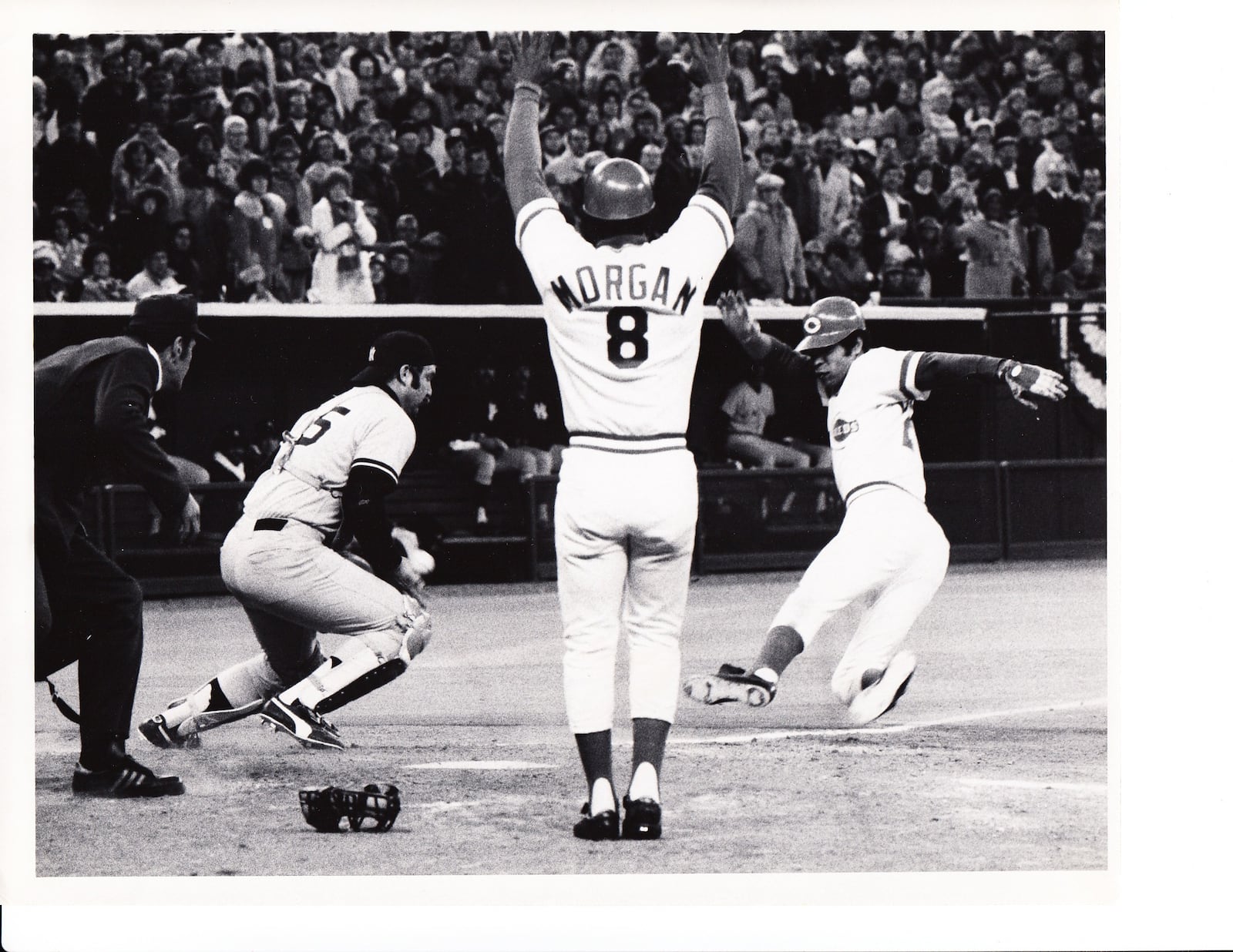 Outfielder Cesar Geronimo scores during a close play at the plate in the 1976 World Series. FILE PHOTO