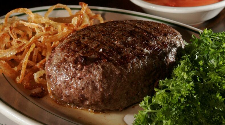 The Pine Club meal, including its signature onion rings. 2008 staff file photo by Lisa Powell