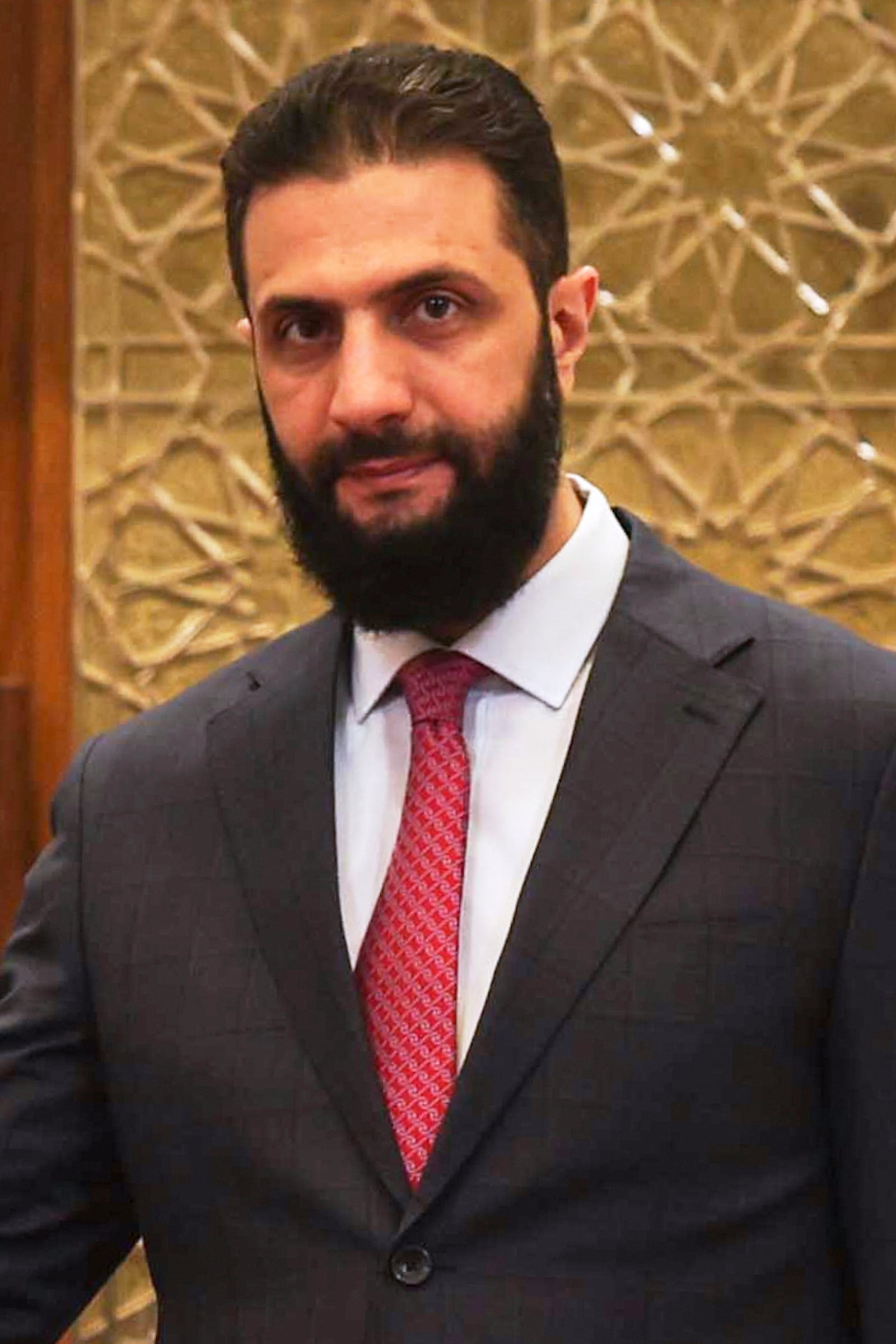 Syrian President Ahmad al-Sharaa attends a meeting with Azerbaijani Deputy Prime Minister Samir Sharifov at the People's Palace in Damascus, Syria, Sunday, May 4, 2025. (AP Photo/Hassan Ammar)