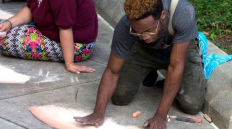 Dayton artist Boy Blue taught several Project Jericho students the possibilities of sidewalk chalk pastels as art over the summer and will be on hand at the first Chalktoberfest competition. CONTRIBUTED